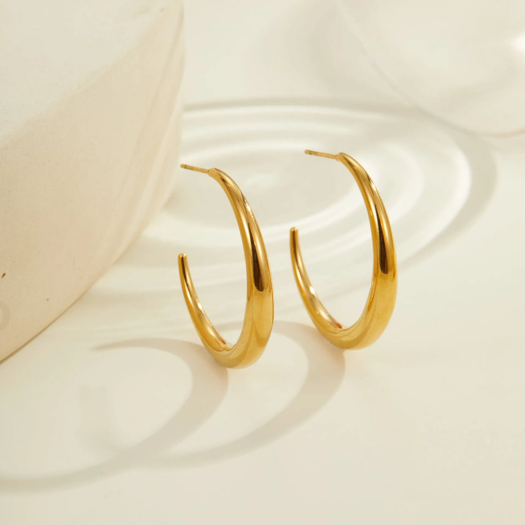 Titanium steel hoop earrings with 18K gold plating in large and small sizes