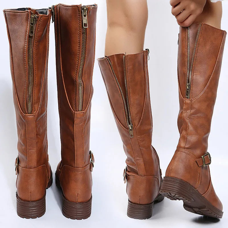 Women's black knight boots with square heel, round toe, and buckle detail on a high cylinder shaft.