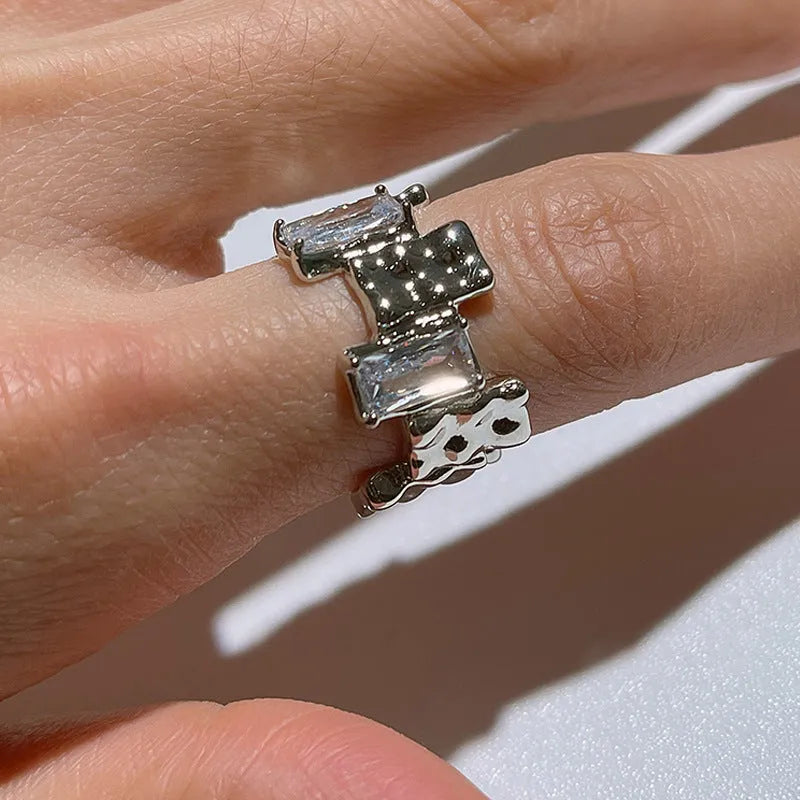 Silver open ring with cross zircon design and geometric retro styling