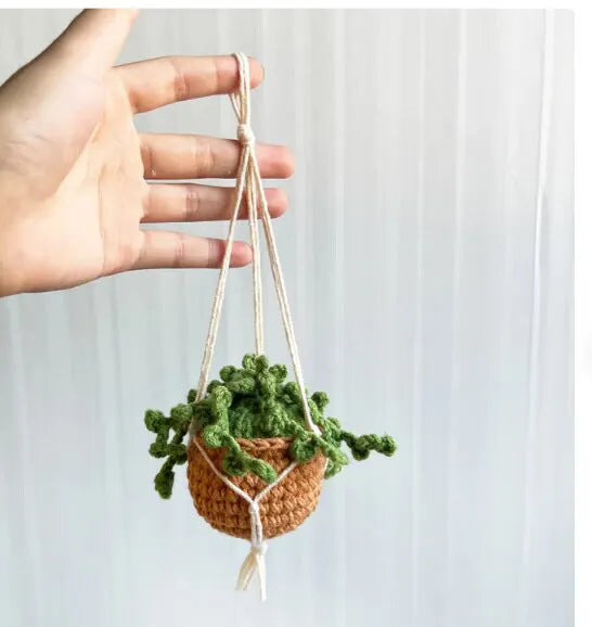 Green and white knitted car plant ornament with hanging rope for dashboard or mirror decoration