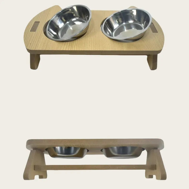 Wooden cat feeder with two stainless steel bowls for food and water on an anti-tip base.