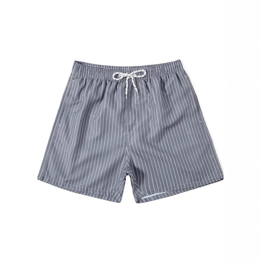 Men's navy blue and grey striped polyester beach shorts with a straight leg cut, laid flat.