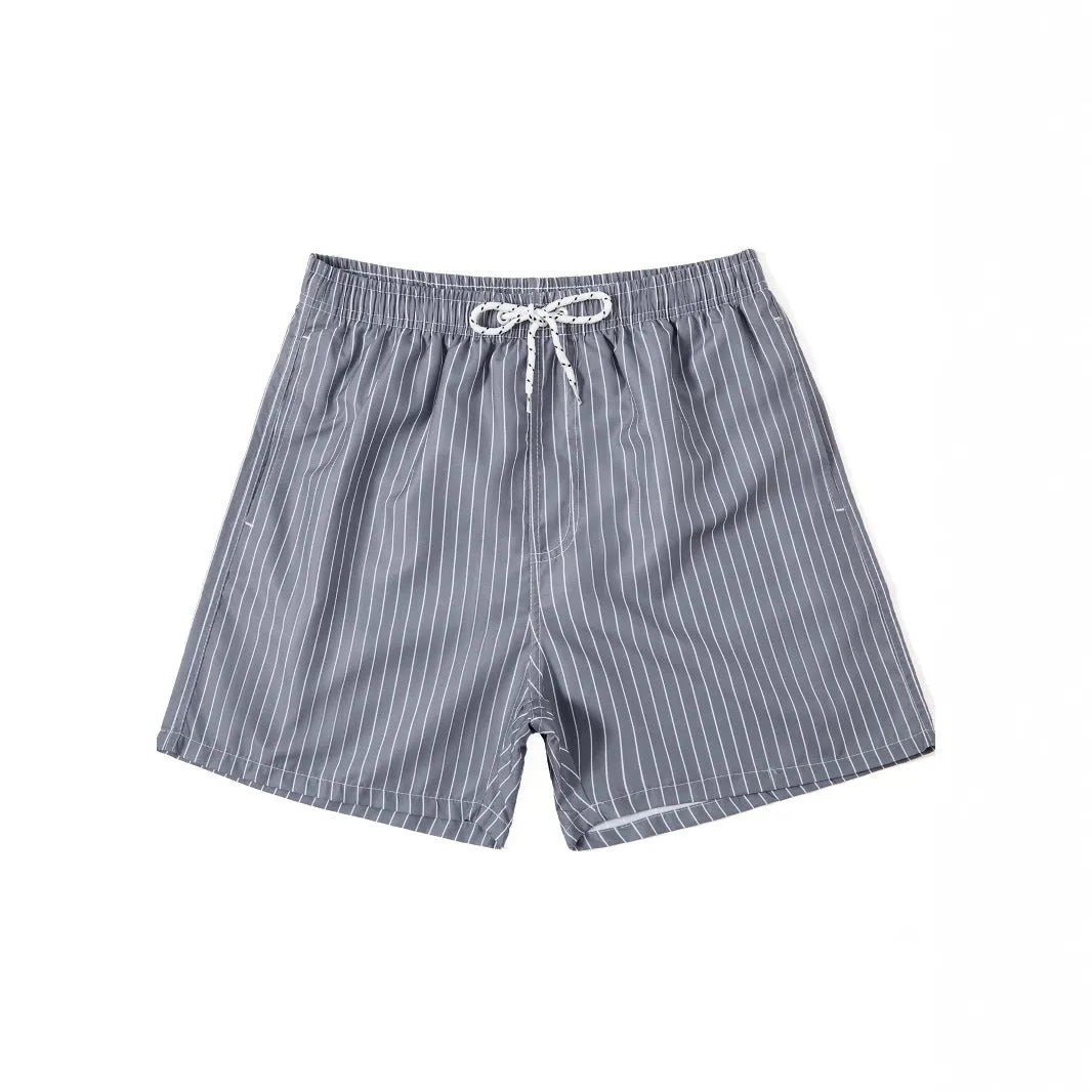 Men's navy blue and grey striped polyester beach shorts with a straight leg cut, laid flat.
