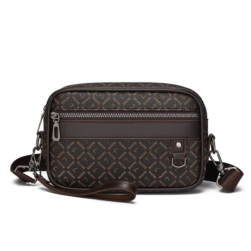 Men's black PU leather messenger bag with a geometric pattern, shown worn crossbody.
