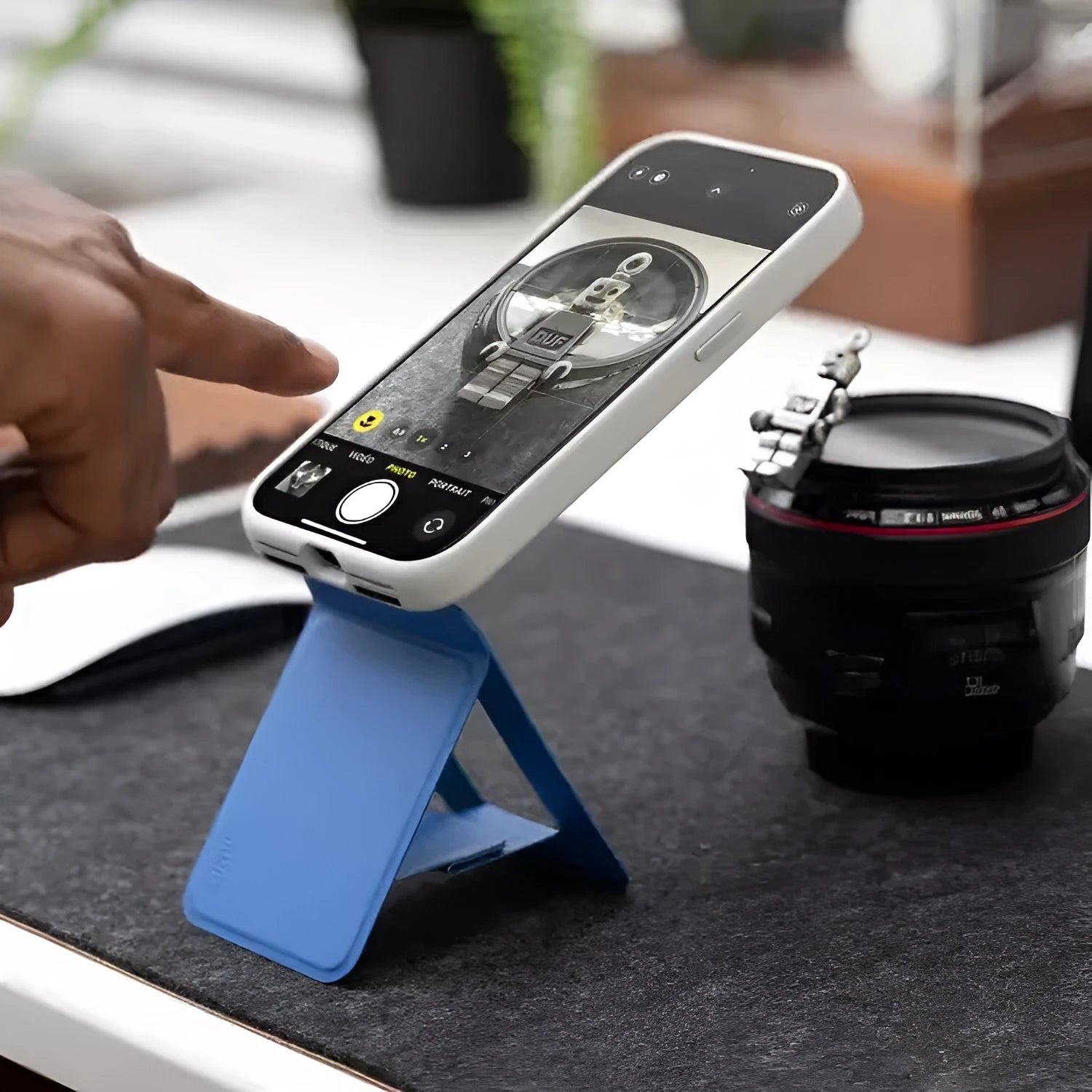 Black magnetic leather phone case with integrated stand, showing side profile and colour options.