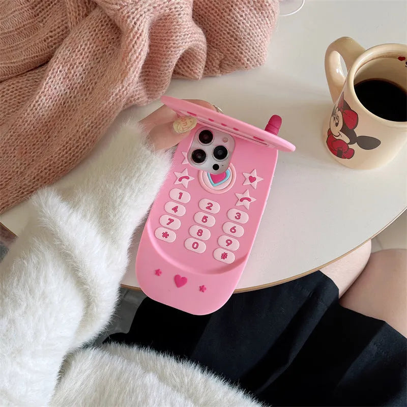 Light pink silicone flip phone case with a mirror, shown next to a rose red version, for iPhone models.