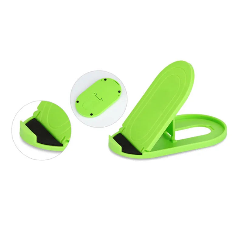 Plastic mobile phone stand with lazy bracket design in assorted colours on a desk.