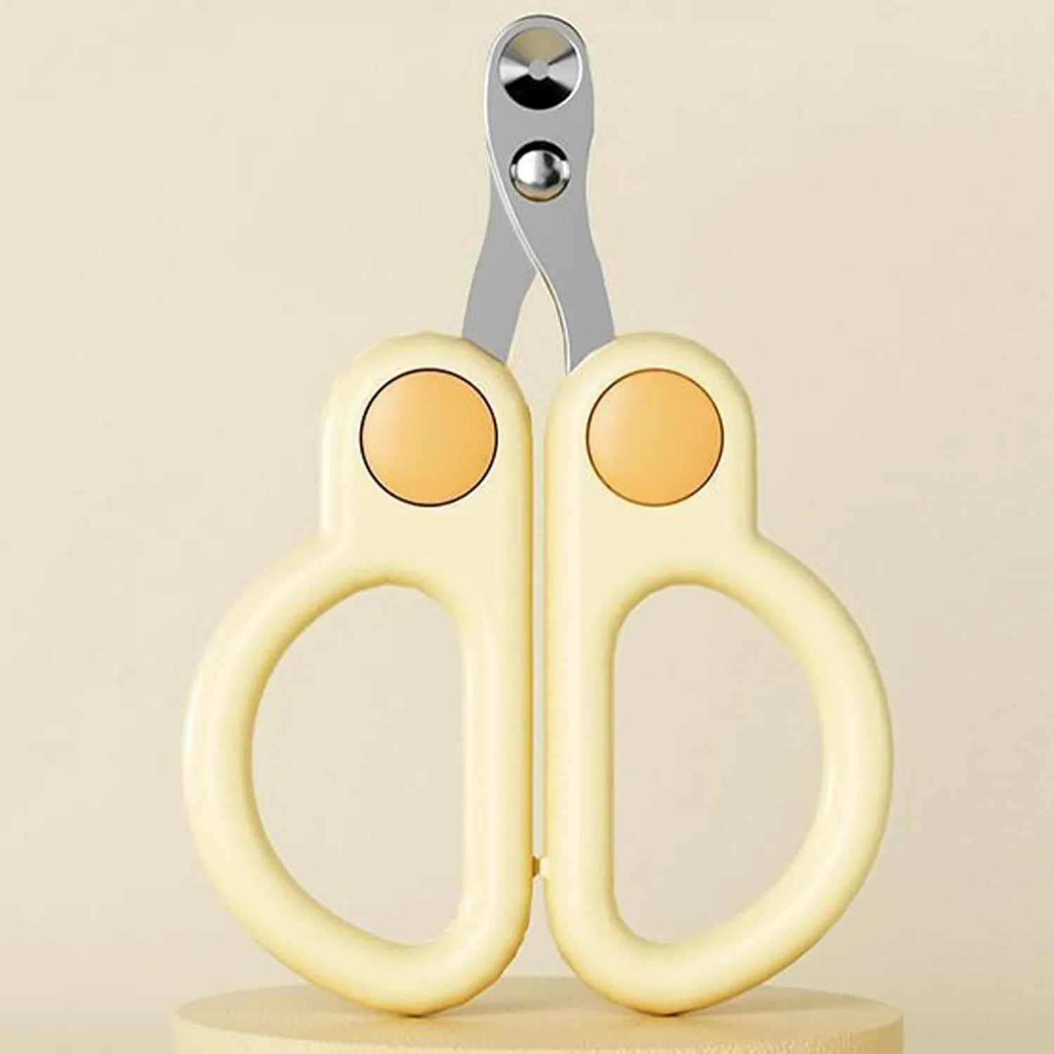 Pet nail clippers with round hole design, stainless steel blades, and ergonomic handles. Available in green or yellow.