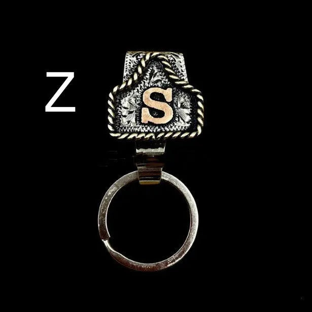 Handmade metal cow tag belt keychain in rustic design with multiple colour options