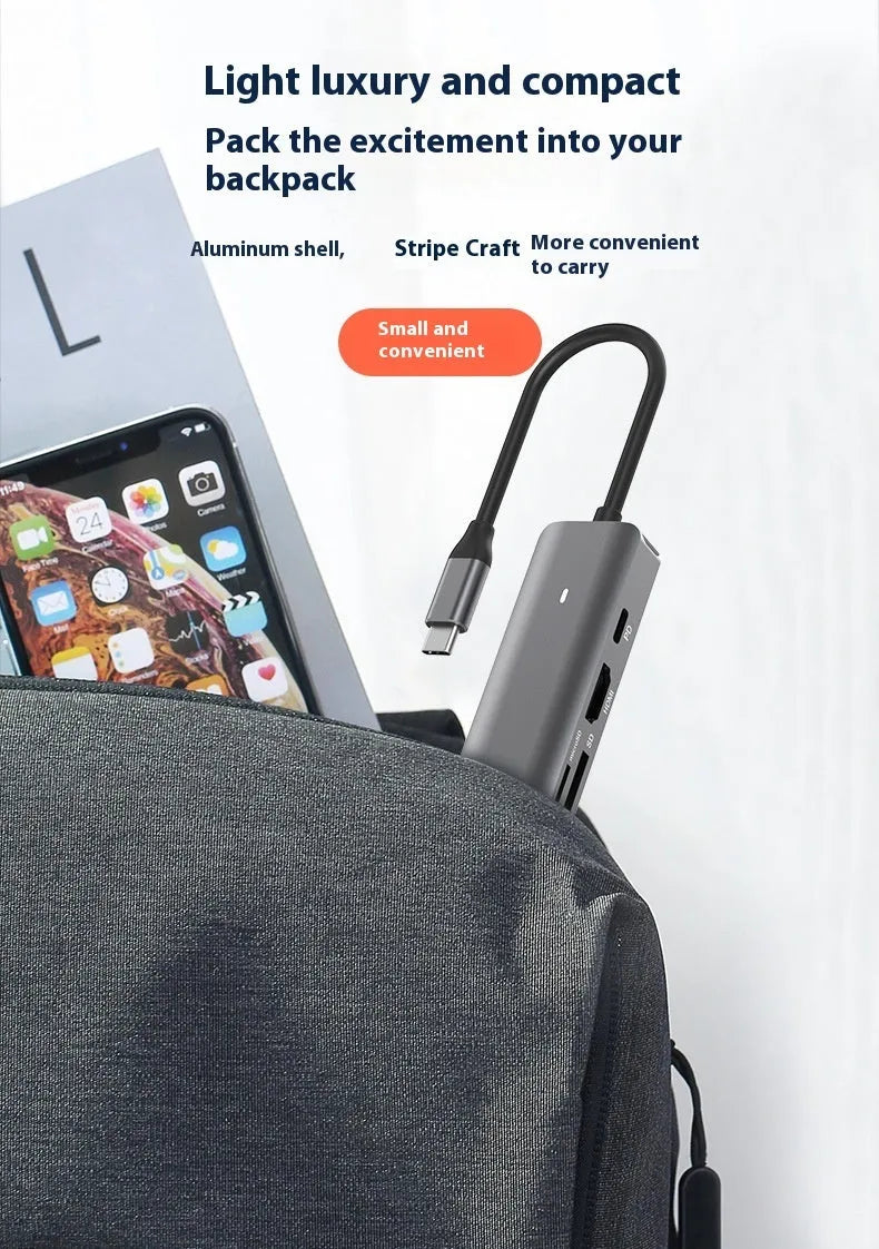 LQT-LH07 model 7-in-1 silver USB C hub showing USB-C plug, PD port, USB-A ports, and SD and microSD card slots.