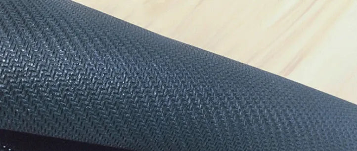 Large patterned desk mat for mouse and keyboard on a wooden desk.