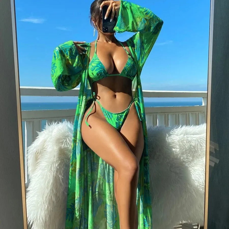 Split long sleeve banded bikini swimsuit set in a floral pattern with a matching outer robe.