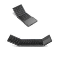 Tri-fold Bluetooth keyboard showing compact folded size next to smartphone for scale