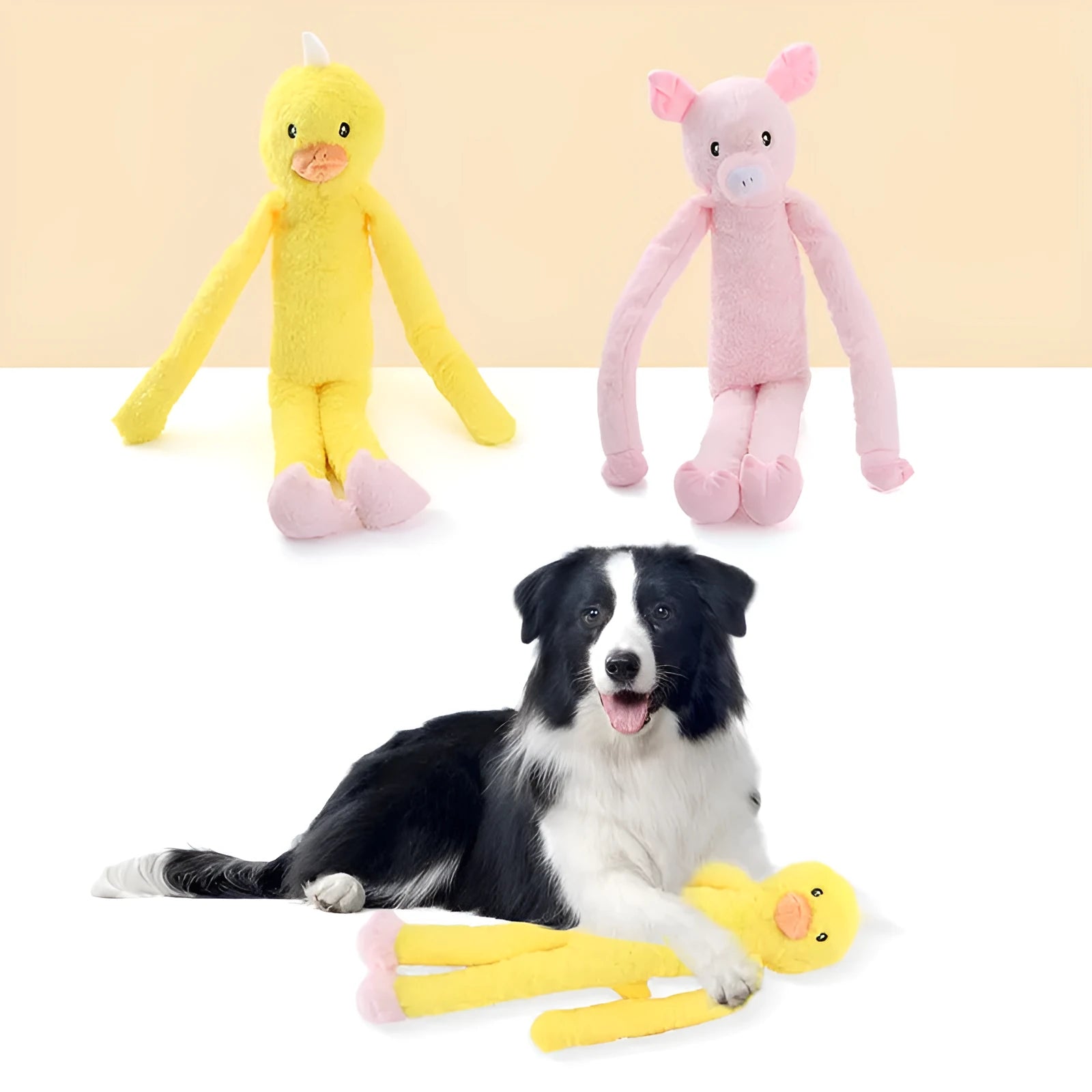 Pink and yellow golden retriever plush dog toy with squeaker and rattle.