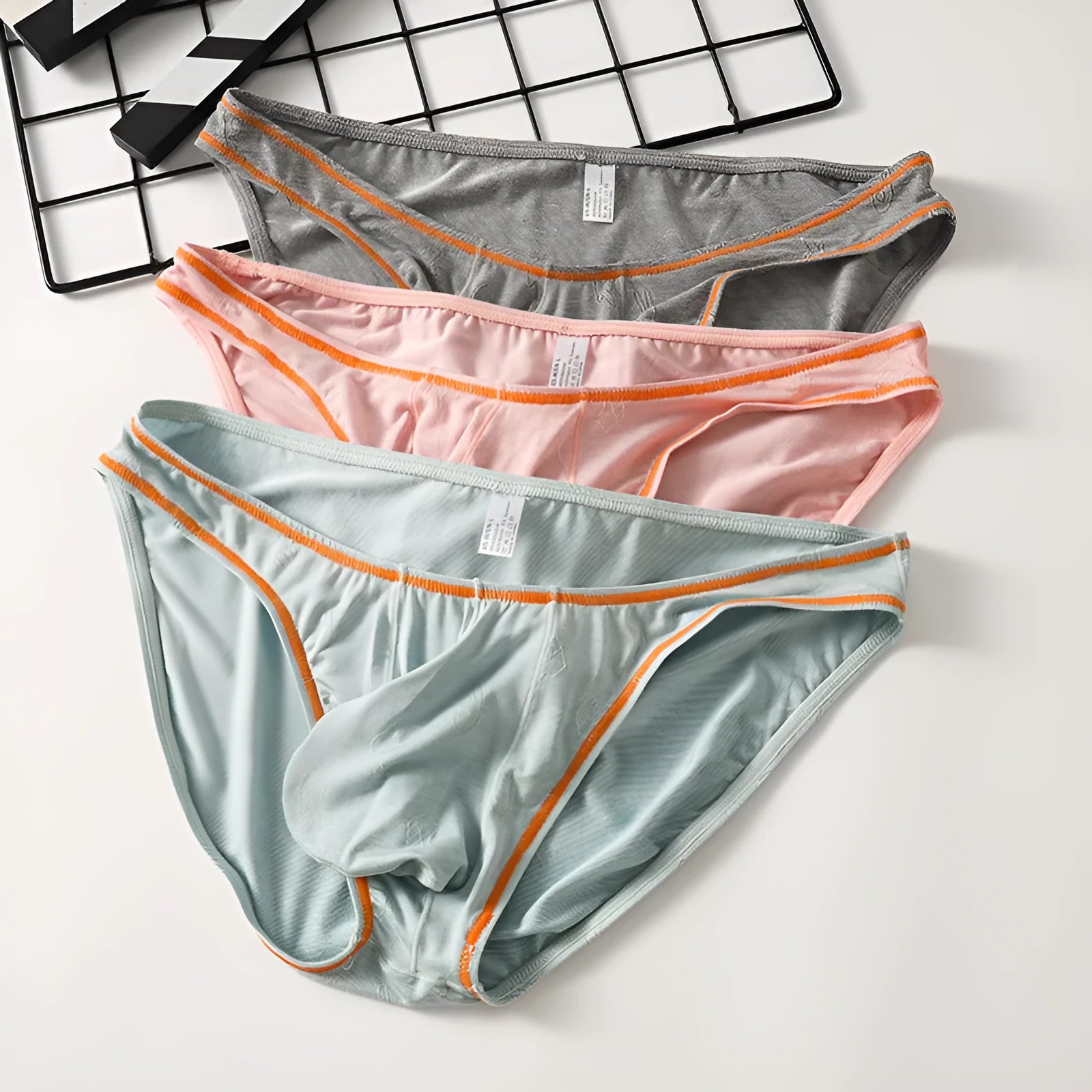 Men's modal hip-lift underwear in dark grey, pink, yellow green, blue, and sky blue colours.