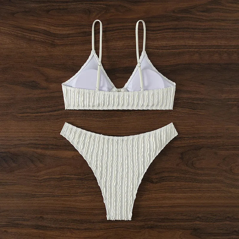 White women's V-neck sleeveless swimsuit top with matching shorts on a mannequin.