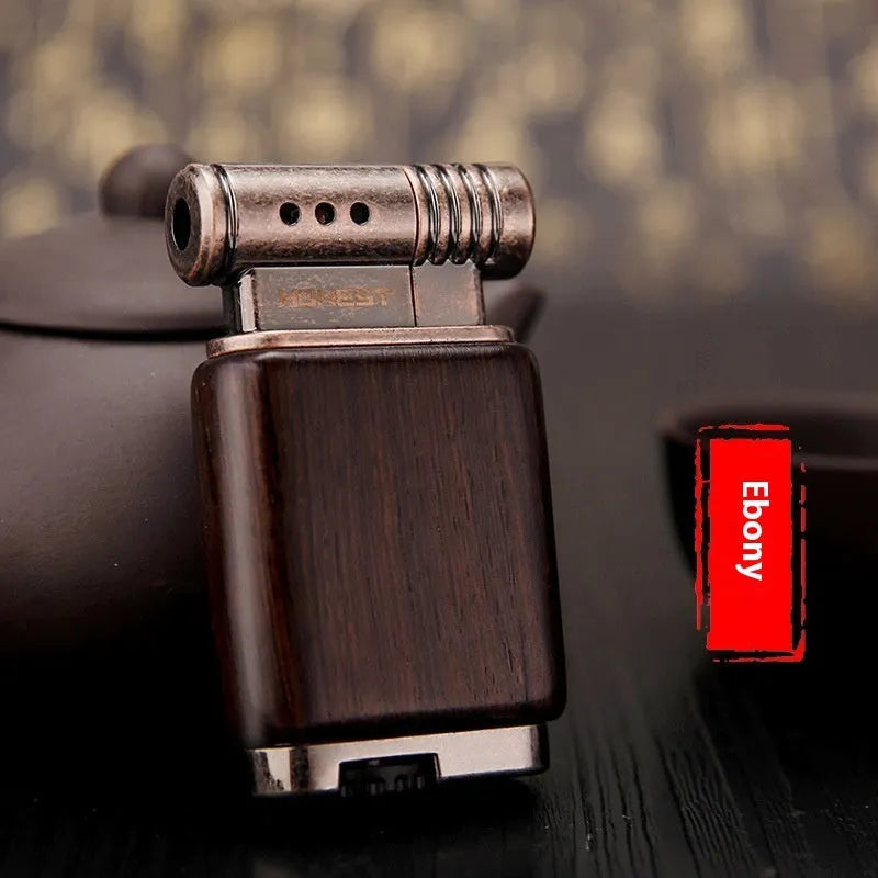 Black wood gas lighter with rosewood decorative finishes including sun face design