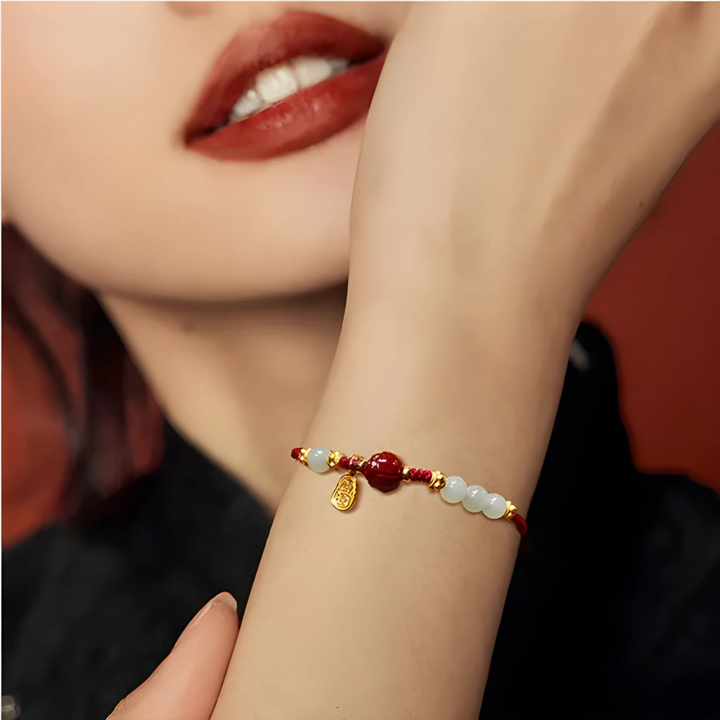 Hetian Jade Cinnabar Red Rope women's bracelet made of 925 silver with an adjustable chain.