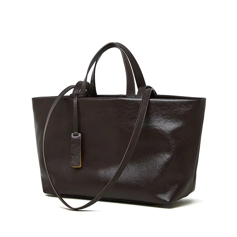 Genuine leather women's underarm shoulder bag in brown, 32x13x22cm, with sewing line detail