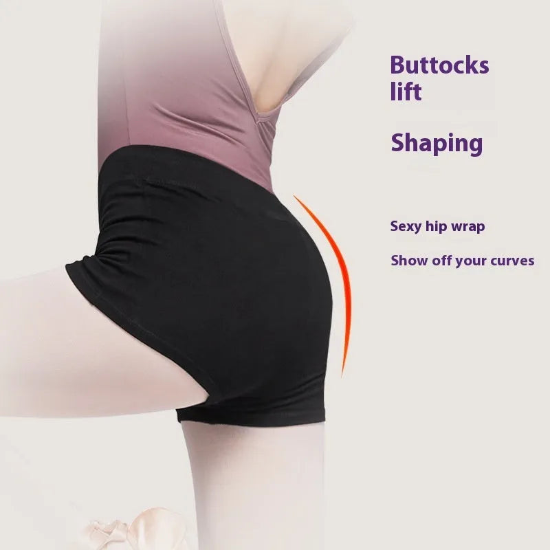 Black cotton women's ballet practice trousers laid flat, showing solid colour and fit for dance exercise.