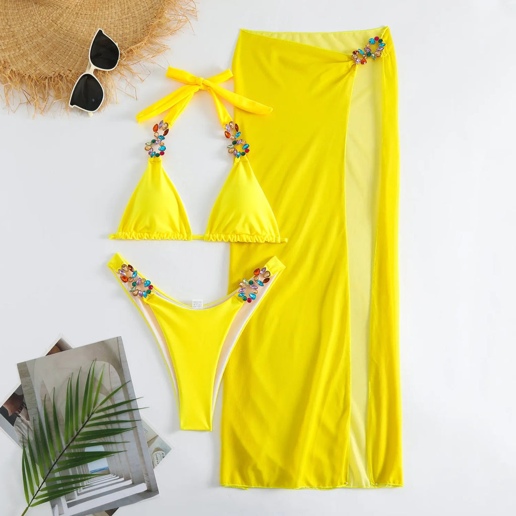 Women's rose red three-piece bikini set with long mesh skirt for swimming.