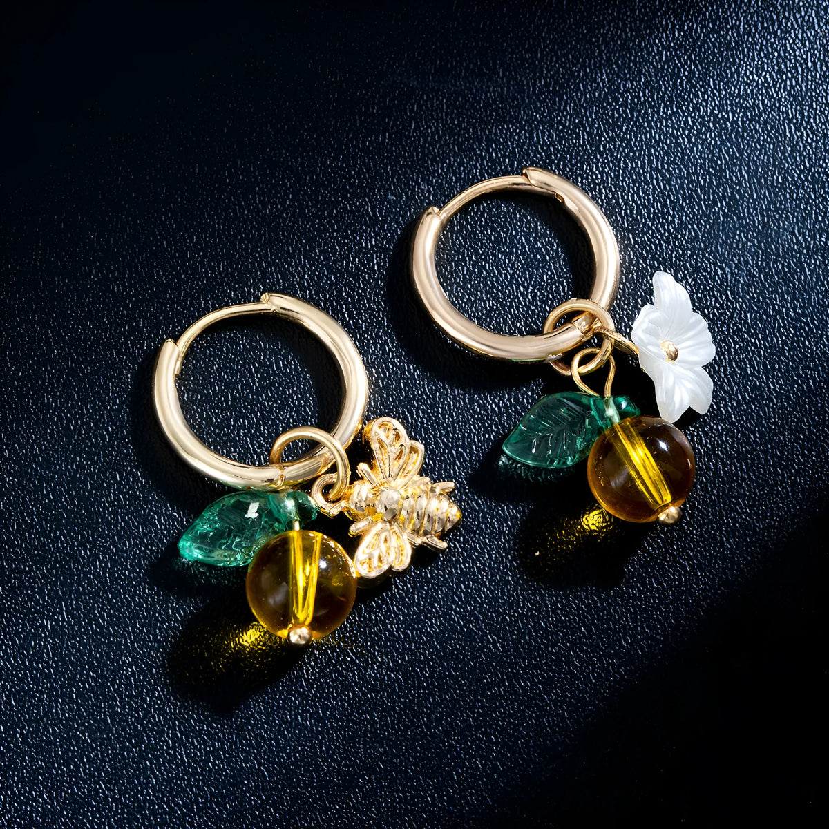 Women's sweet ear cuffs in XY-123 with bee, glass, leaf, and flower pendant details, supplied as one pair.