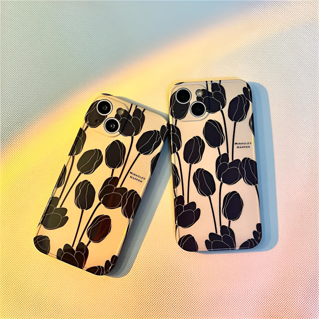 Black silicone iPhone case with a raised embossed tulip flower design on the back.