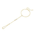 S925 sterling silver tassel bracelet with integrated ring and chain, shown in silver or gold electroplated finish
