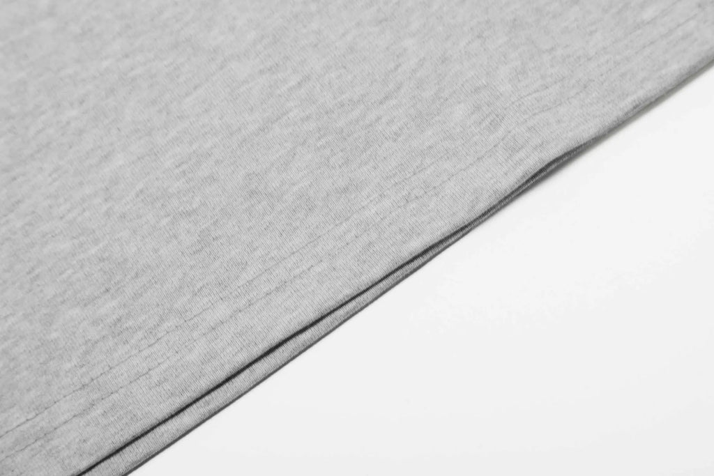 Men's grey loose fit cotton long sleeve pullover top on a hanger