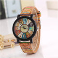 Casual vintage women's watch with brown leather strap and silver 37mm round dial.