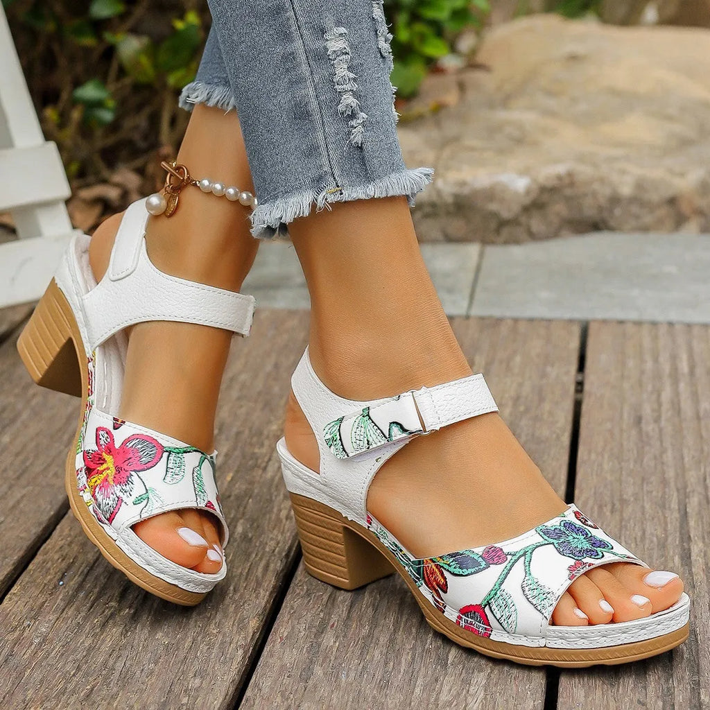White women's casual sandals with high heel, Velcro buckle straps, and rubber sole.