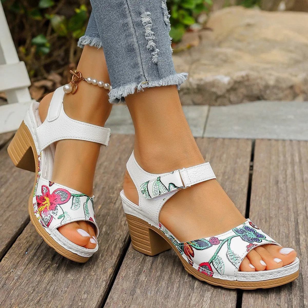 White women's casual sandals with high heel, Velcro buckle straps, and rubber sole.