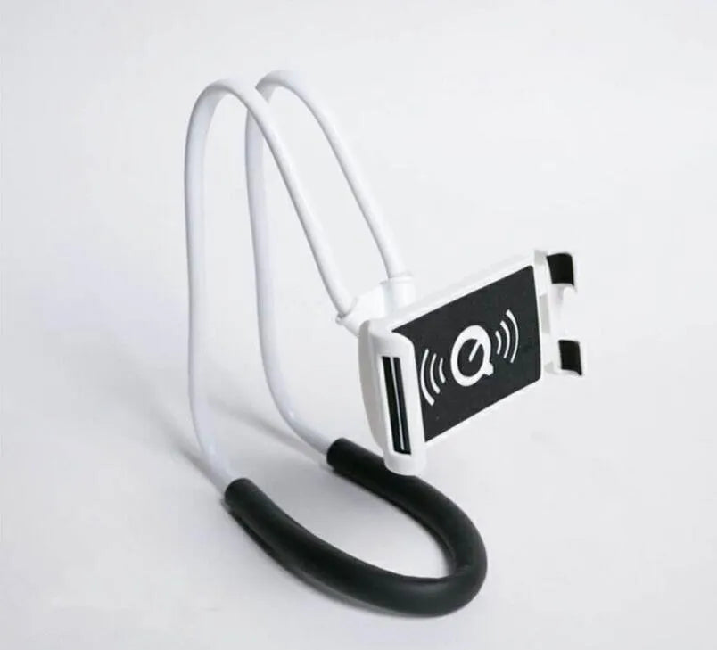 White plastic and foam 360-degree rotatable universal phone holder on a table.
