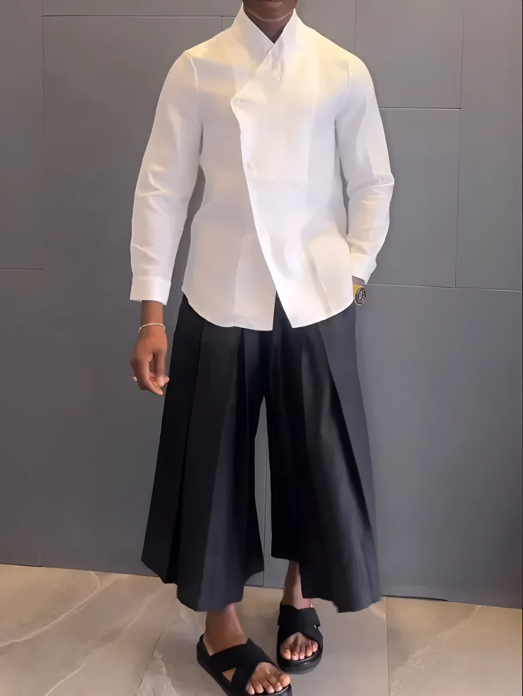 Women's white asymmetric long sleeve shirt and black pleated trousers co-ord set