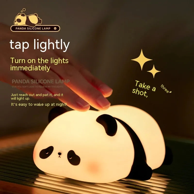 Panda-shaped night light with black and white silicone construction showing LED glow