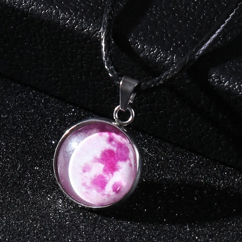 Luminous alloy necklace with a glass pendant depicting a Christmas moon night sky, showing the extension chain.