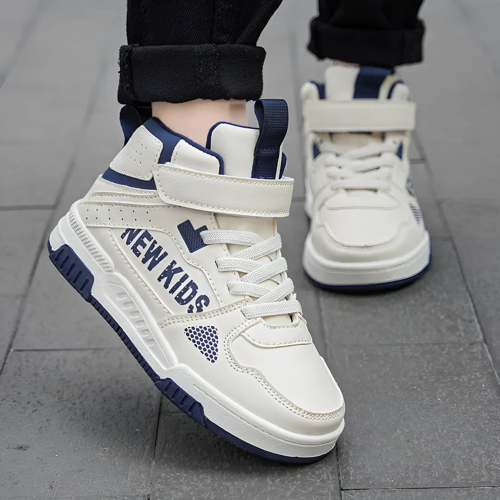 Children's buckle-fastened street sneakers in neutral colours with PU upper and rubber sole.
