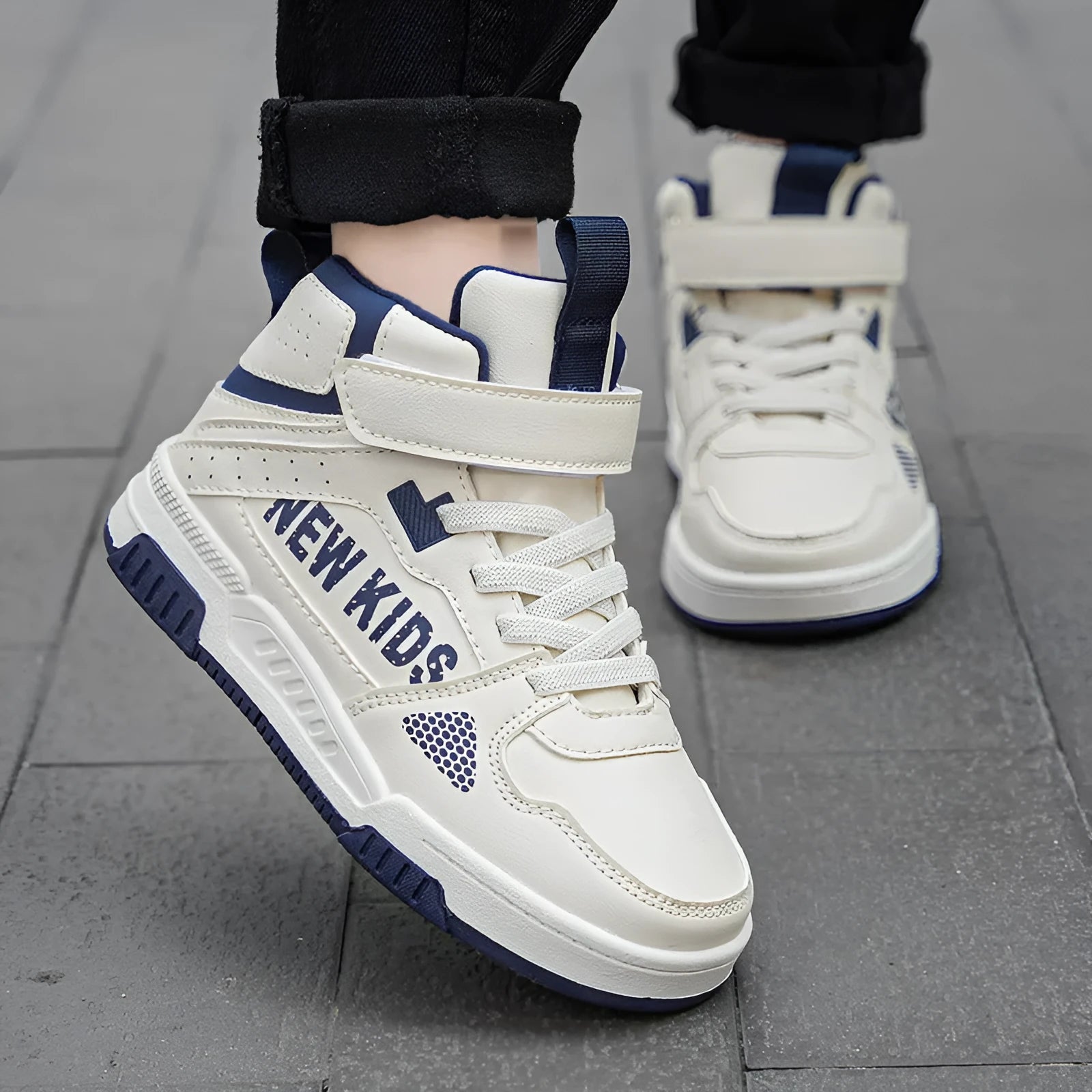 Children's buckle-fastened street sneakers in neutral colours with PU upper and rubber sole.
