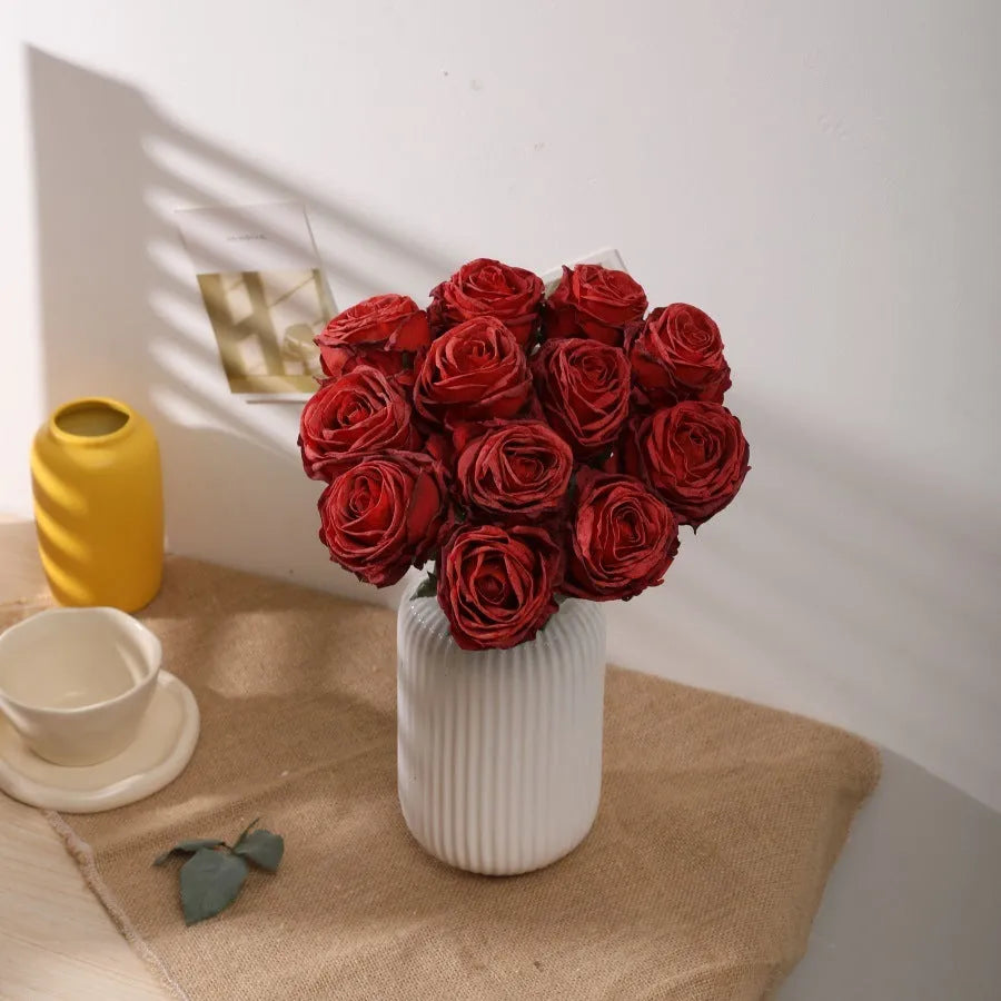 Single burnt edge simulated silk rose artificial flower with 38cm stem on neutral background