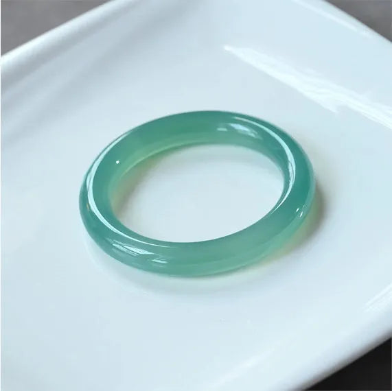 Natural agate wide tyre bracelet showing bead detail and colour variation with size measurement indicators