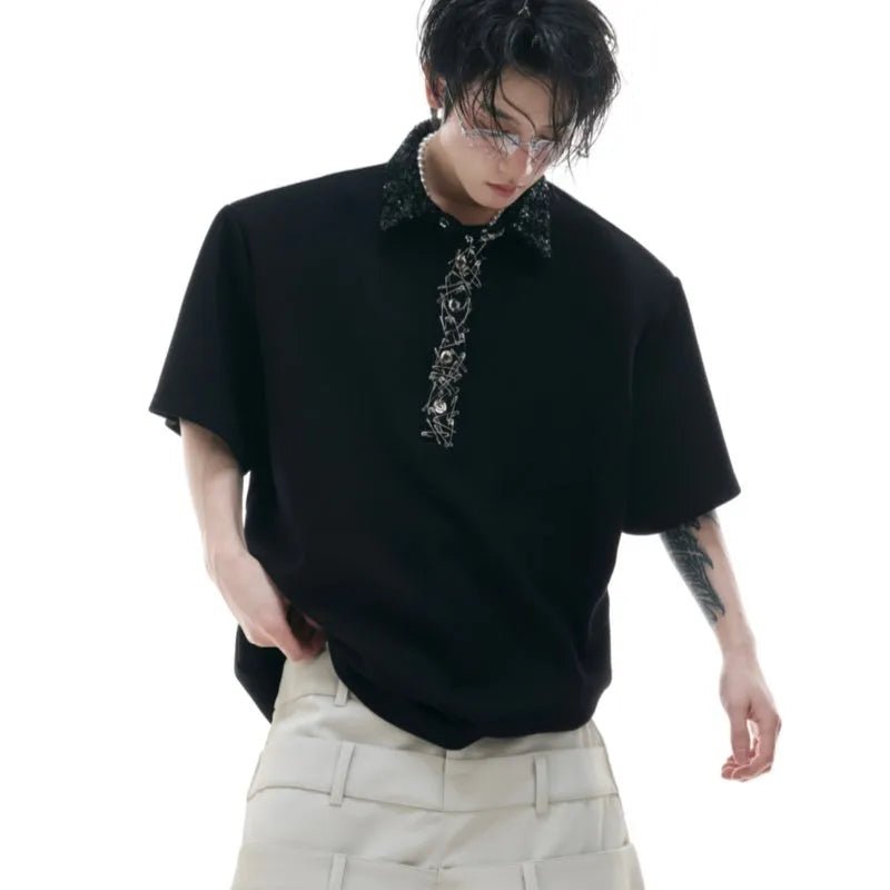 Men's black loose polo shirt with heavy embroidery and sequins on a square collar.