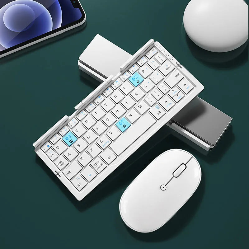 Silver white aluminium folding Bluetooth keyboard open with phone in stand showing 60-key layout