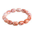 Natural cherry agate bracelet with 10x14mm barrel beads and a geometric ruyi design.