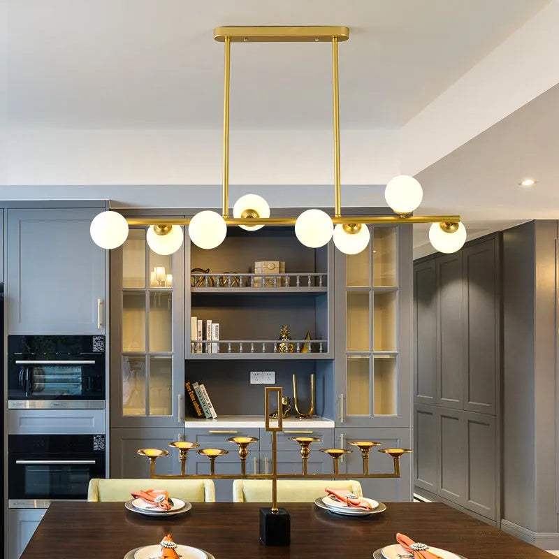 Glass bubble ball chandelier with black iron frame, clear glass shades, and multiple arms