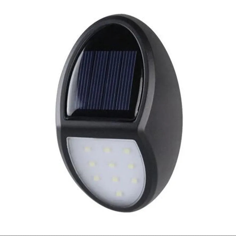 Black rectangular LED solar wall light mounted on an outdoor surface