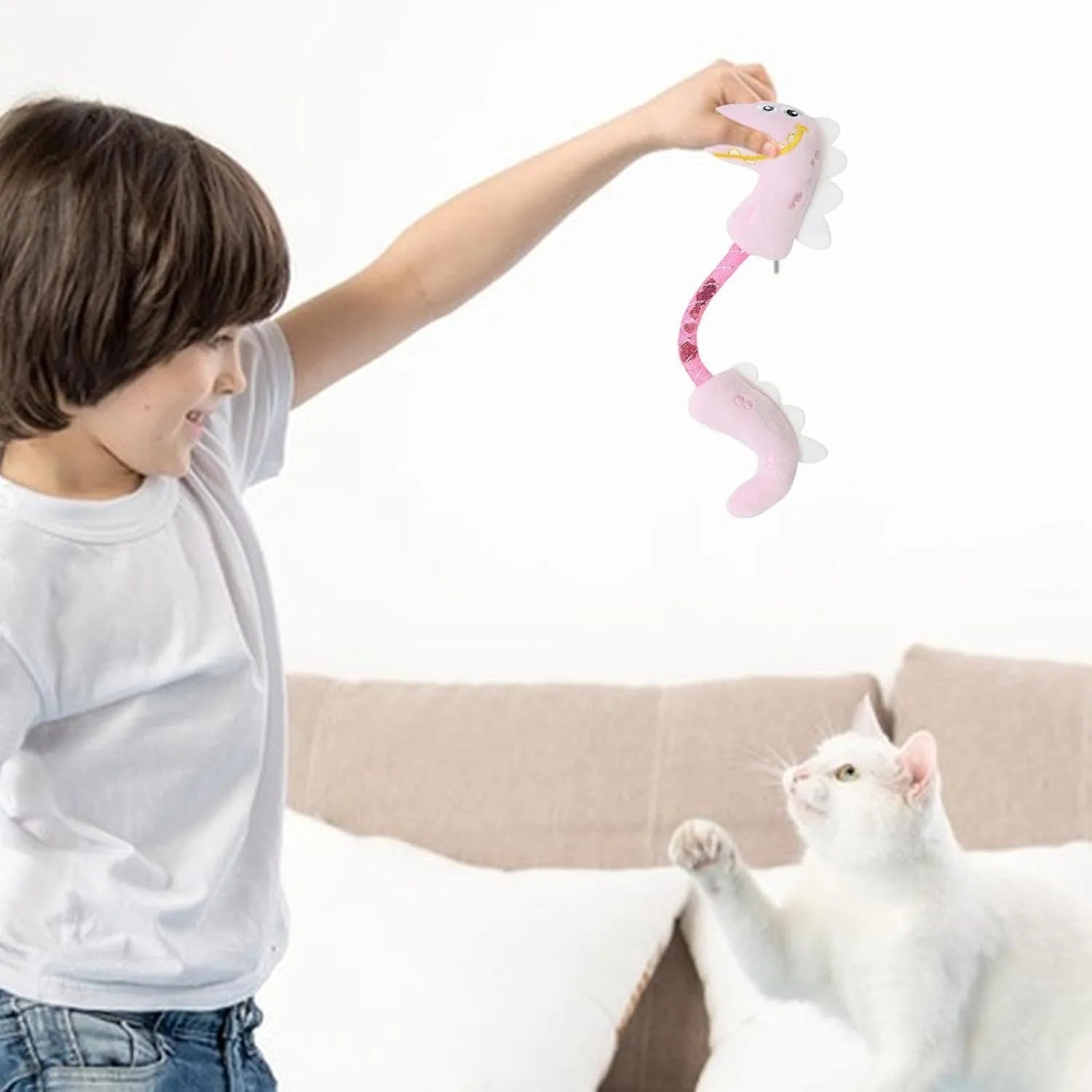 Four cat chew toys including plush mouse, fish, bunny, and chew toy in pink, purple, and yellow colours