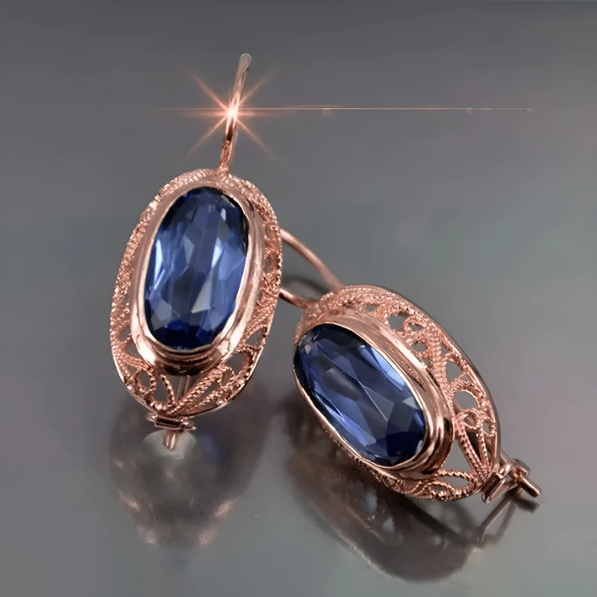 Women's copper and glass geometric earrings in red and blue with ellipse and ring shapes