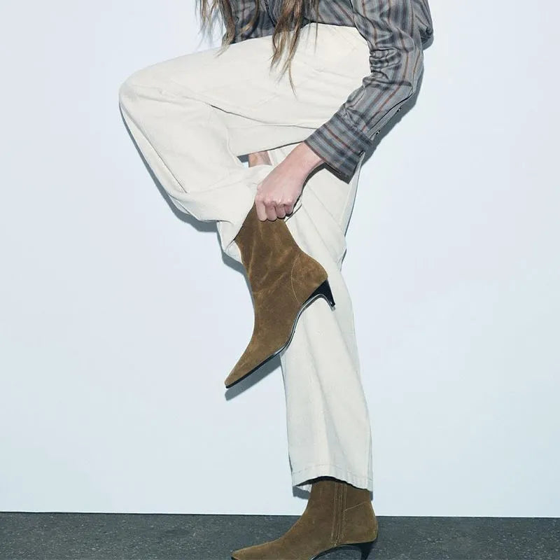 Brown women's square toe ankle boots with a side zipper and a kitten heel on a waterproof platform sole.
