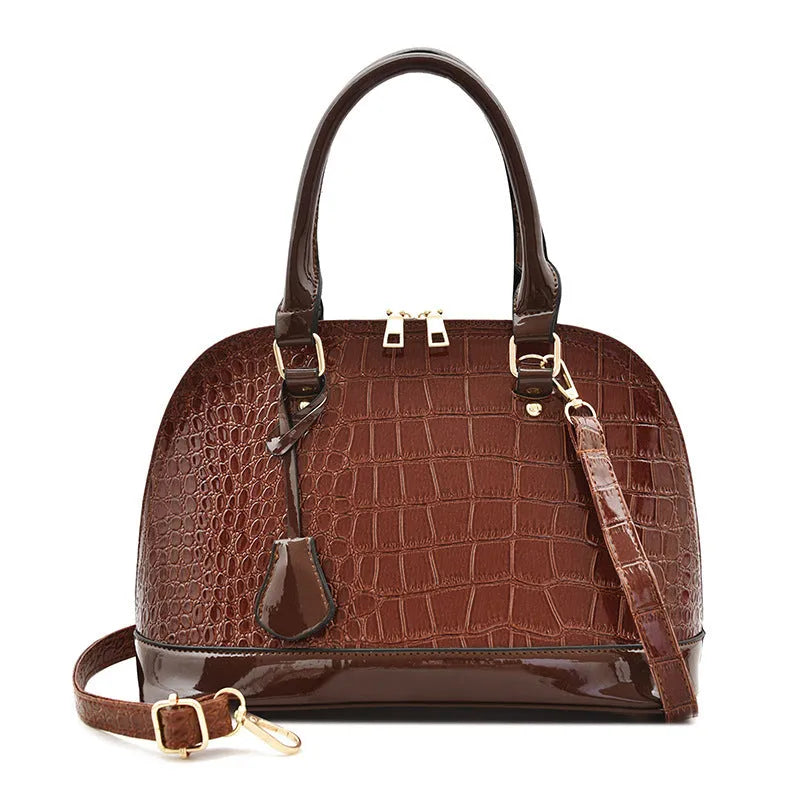 Large shiny black PU leather crossbody shoulder bag with a shell shape.