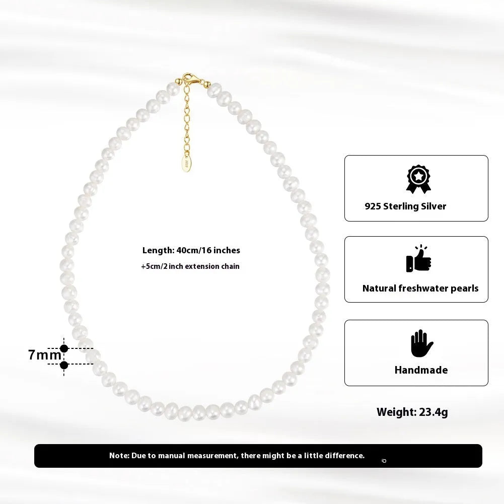 Women's adjustable silver necklace with natural freshwater pearls on a model